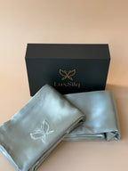 LuxSila branded box with a folded gray fabric item on a beige background
sea foam blue