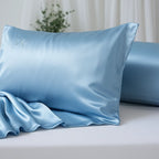 Blue satin pillowcase on a bed with a light background
sea foam blue