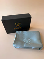 LuxSilq satin sheet and packaging box on a beige background
sea foam blue